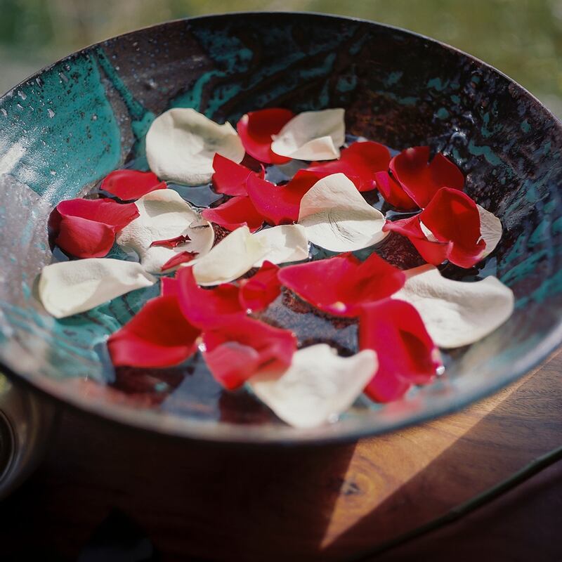 A bowl of rose petals in the home of John Shields. Photograph: Leslye Davis/The New York Times