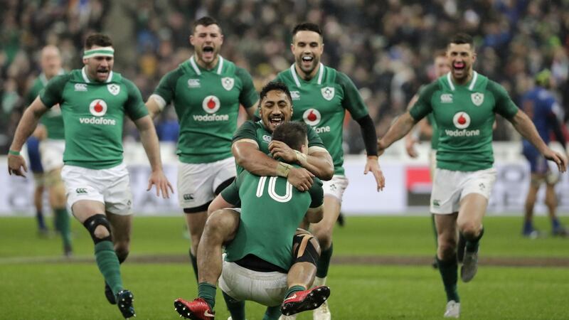 Johnny Sexton celebrates with Bundee Aki after scoring a drop goal to beat France 15-13 in their Six Nations opener at the Stade de France in  2018. Photograph:  Thomas Samson/AFP/Getty Images