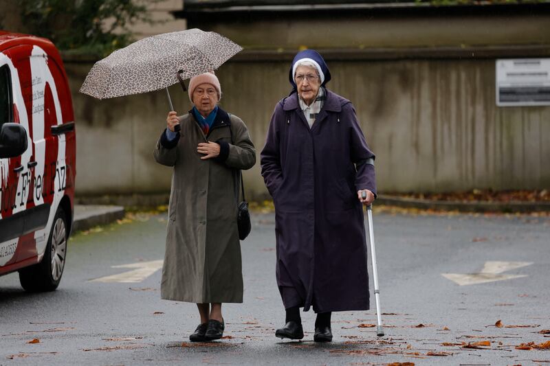 Members of the religious community arrive at the funeral of campaigner and advocate Sr Stan. 