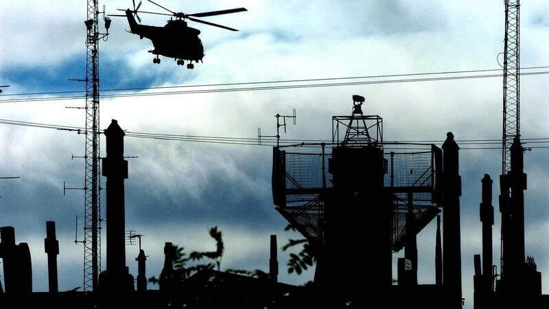 A helicopter flying over an army watchtower in Crossmaglen, Co Armagh: Cross is an 'anti-ideology' book, says Austin Duffy. Photograph: John Giles/PA 