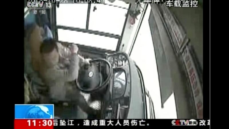 A bus driver strikes a passenger moments before the bus plunged off a bridge into the Yangtze River in Wanzhou in southwestern China’s Chongqing Municipality last Sunday. Photograph: CCTV via AP Video