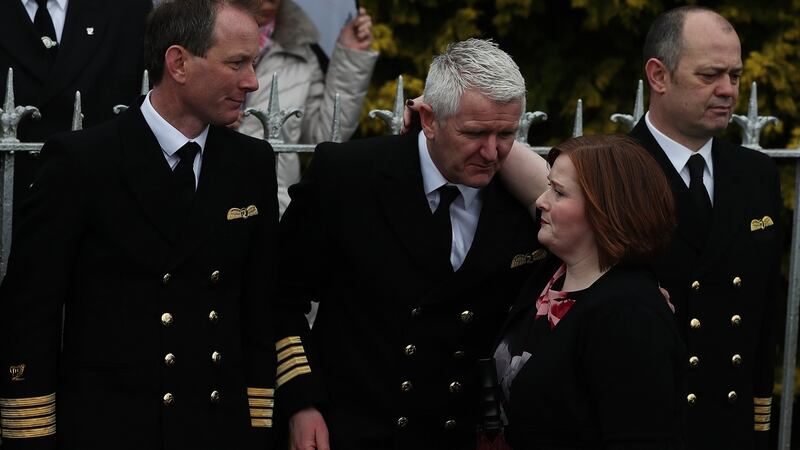 Niamh, sister of Capt Dara Fitzpatrick with members of the Coast Guard outside the church ahead of the funeral of her sister. Photograph: Brian Lawless/PA