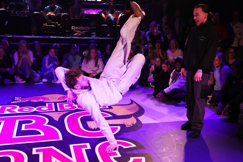 B-boy Aleonthrows another move as B-boy Sunsid (Eduard Huk) looks on. Photograph: Alan Betson