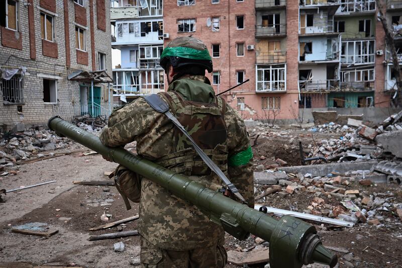 A Ukrainian soldier carries a portable anti-aircraft missile system in Bakhmut, Donetsk region, Ukraine. Photograph: Roman Chop/AP