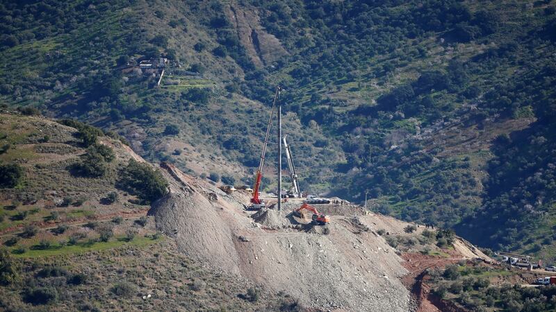 A crane removes steel tubes after failing to place them into the drilled well. Photograph: Reuters/Jon Nazca