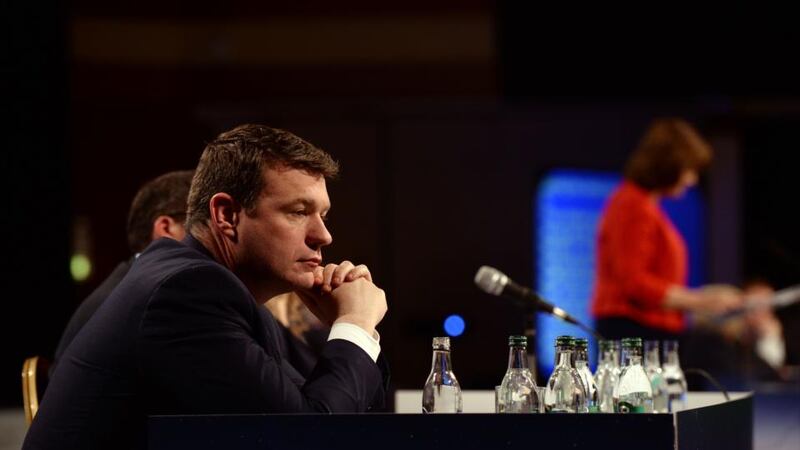 Minister for the Environment and Labour Party deputy leader Alan Kelly listens to Tánaiste Joan Burton’s speech to the party’s conference in Killarney. Photograph: Cyril Byrne/The Irish Times