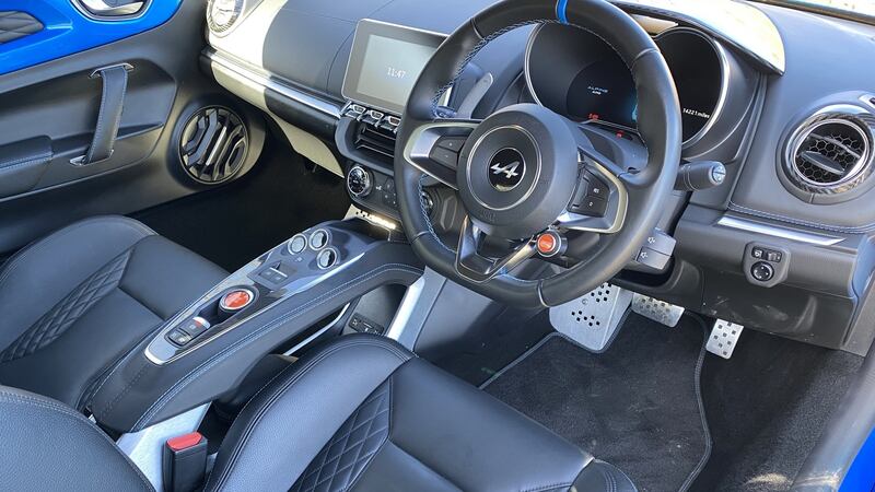 In the cockpit, you sit low and laid back on wonderfully supportive and comfortable leather bucket seats