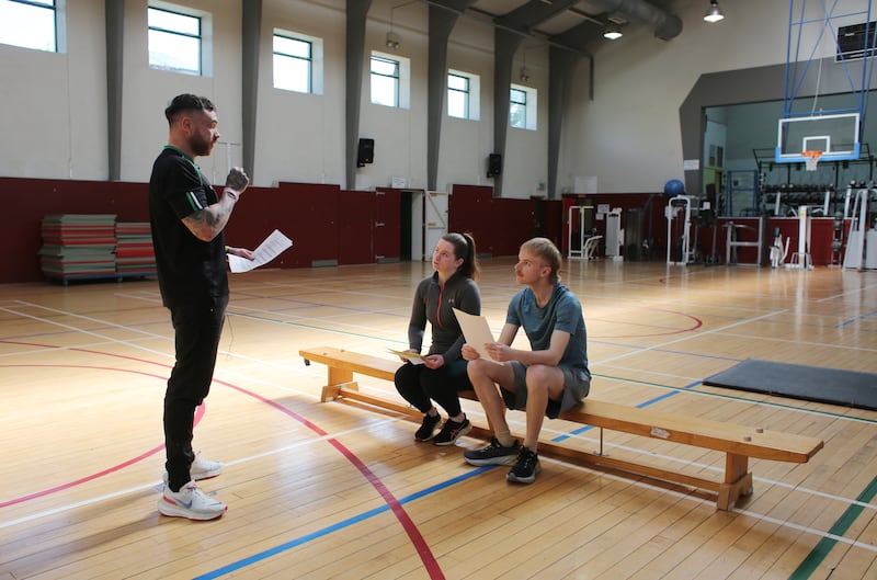 Sgt Ross Hayden goes through the fitness test instructions with Conor Capplis and Katie Mellett. Photograph: Bryan O’Brien