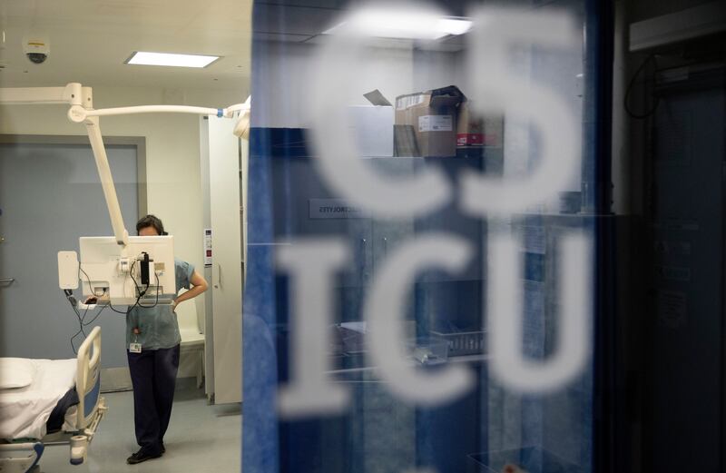 A nurse prepares an ICU room. Photograph: Chris Maddaloni