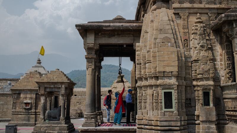 Devotees walk through the Shiv Temple in Baijnath, India. Photograph: Rebecca Conway/The New York Times