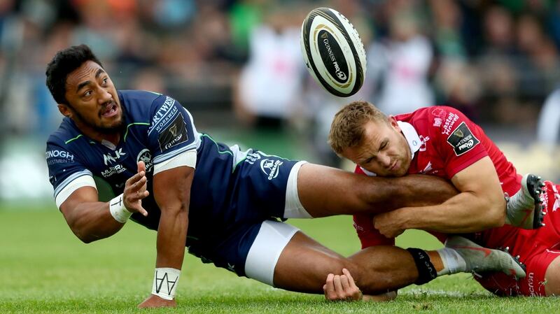 Bundee Aki offloads to Tom Farrell to in the build-up to Connacht’s first try in the Guinness Pro 14 game against Scarlets at the Sportsground in Galway. Photograph: James Crombie/Inpho
