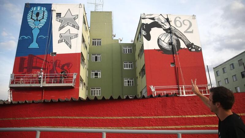 A building in Sao Paulo honours Brazil’s 1962 World Cup victory over Czechoslovakia.Brazilian authorities pledged to spend €4 billion on infrastructure in advance of the World Cup. Only €1 billion worth of projects has been delivered, with none in four of the 12 host cities – São Paulo, Manaus, Salvador and Porto Alegre. Photograph: Mario Tama/Getty Images