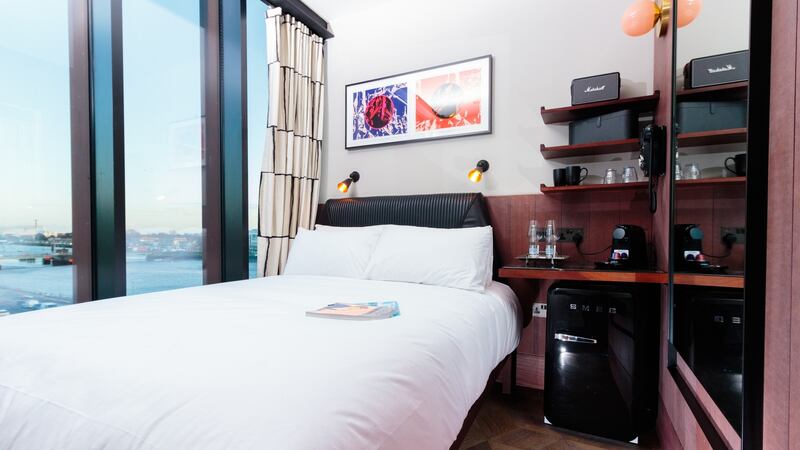 Headboards are pleated, padded leather. Absent are obsolete cushions, trouser presses, wardrobes. Instead, there is a small Smeg fridge, fully stocked; a Dyson hairdyer; a large smart TV with Netflix; a Marshall Radio; and a cocktail shaker - the new kettle of a certain type of city hotel room.