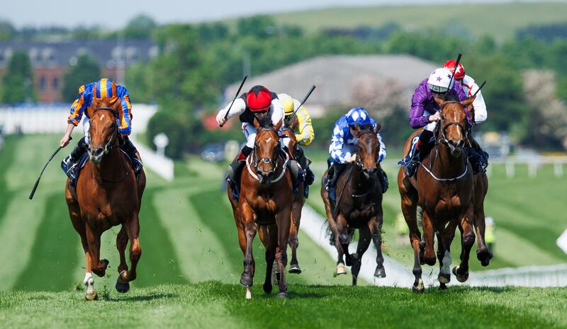 Ryan Moore (left) onboard Fairy Godmother comes home to win the Coolmore Stud Irish EBF Fillies' Sprint Stakes at Naas. Photograph: Tom Maher/Inpho