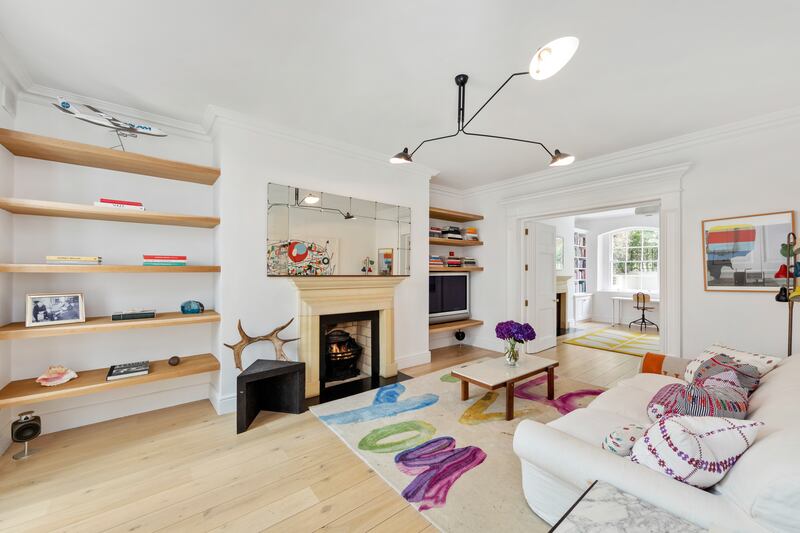 The all white palette continues in the reception rooms at garden level