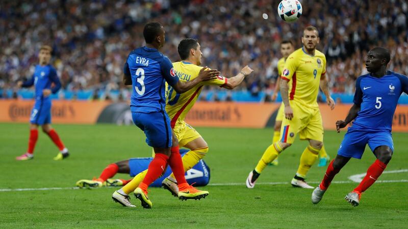 Romania’s Nicolae Stancu is fouled by France’s Patrice Evra resulting in a penalty. Photo: Lee Smith/Reuters