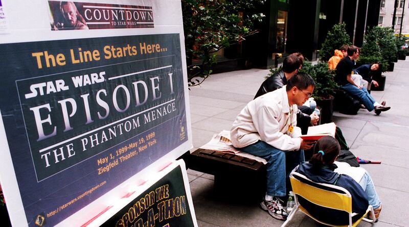 Fans line up at the Ziegfeld Theatre in New York to be the first to see "Star Wars: Episode 1 - The Phantom Menace" that is scheduled to open May 19th, 1999. A group of people who sit in four-hour shifts have been in line since May 1st. AFP PHOTO Stan HONDA (Photo credit should read STAN HONDA/AFP/Getty Images)