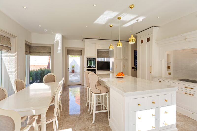 A dining area lies in the open plan kitchen space