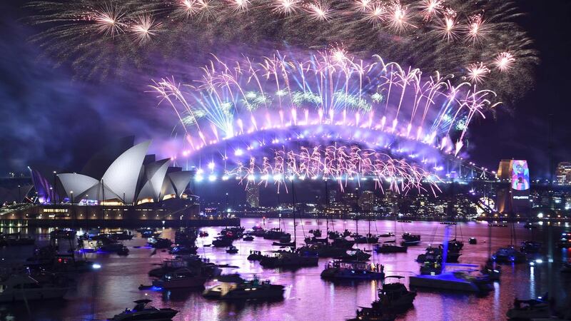 New Year’s Eve fireworks erupt over Sydney’s  Harbour Bridge and Opera House during the fireworks show. Photograph: AFP