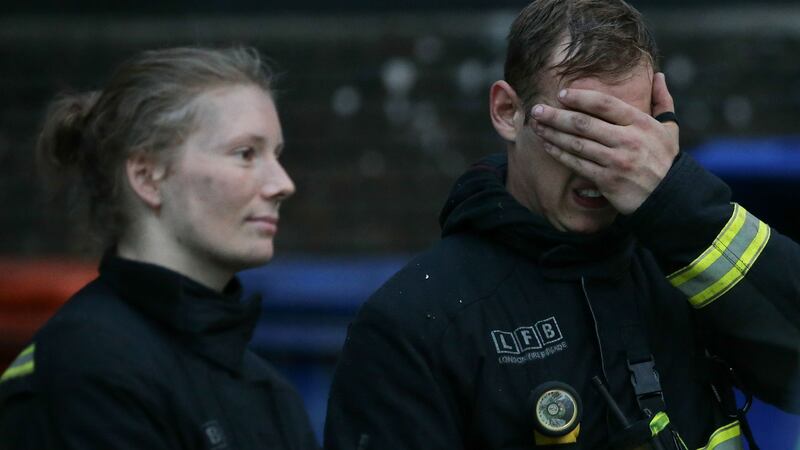 Firefighters at the scene of a  huge fire at Grenfell Tower. Photograph: Daniel Leal-Olivas/Getty
