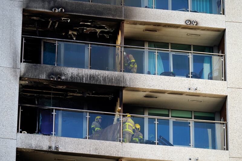 Emergency services deal with the damage on Sunday. Photograph: Niall Carson/PA Wire