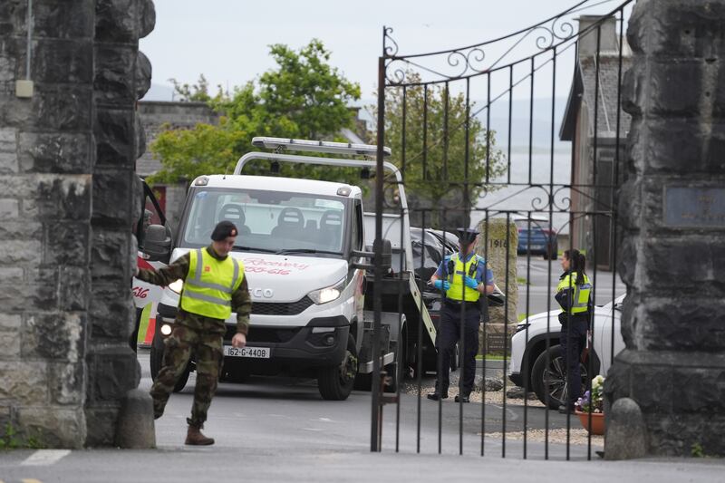A car wrapped in plastic is removed from the scene at Renmore Barracks in County Galway. Photograph: Brian Lawless/PA Wire