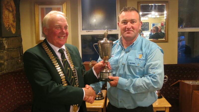 ITFFA president, Albert Berry presenting Dave Egan with Lennon Trophy as winner of National Interprovincial Competition