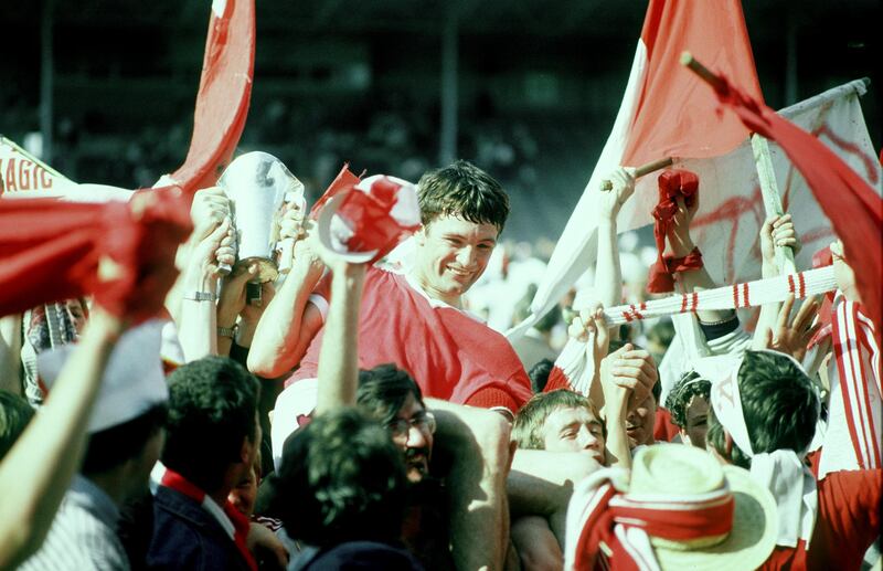 Cork captain Jimmy Barry Murphy and the cup are carried by the Cork fans after the Munster final win over Waterfrod in 1982. Photograph: Billy Stickland/Inpho 