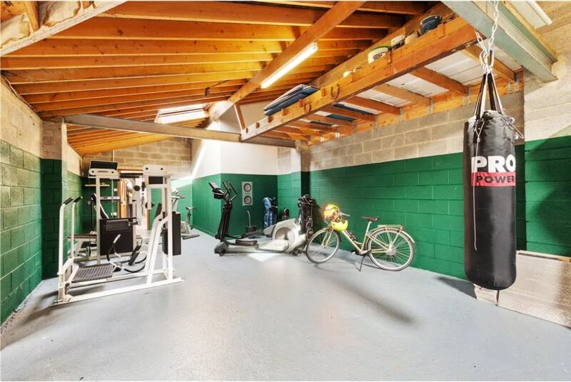 The 100sq m mews/garage is being used for storage and as a home gym. 