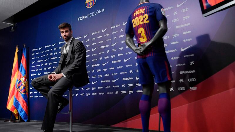 Barcelona’s Catalan defender Gerard Pique attends a press conference to officially announce his contract renewal at the Camp Nou stadium. Photograph: Getty Images