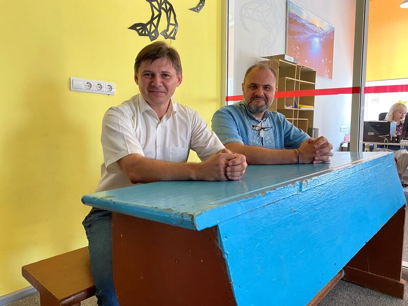 Professors Andrii Shaikan (left) and Valentyn Orlov sit at Zelenskiy’s former desk. Photograph: Lara Marlowe