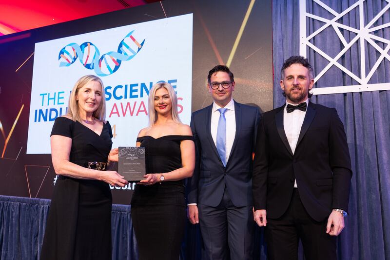 Adrienne Fleming, awards judge, presents the innovation of the year award to Deciphex team