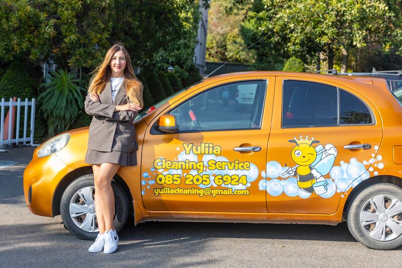 Yuliia Bozhok with her business car: her cleaning company has been up and running for only six months but she has built up a book of clients and is already making a profit. Photograph: Patrick Browne