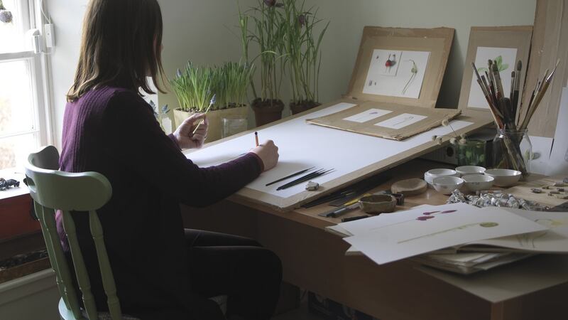 Wicklow-based botanical artist Holly Somerville, one of the ISBA members participating in the ‘Plandaí Oidreachta’ project, at work in her studio