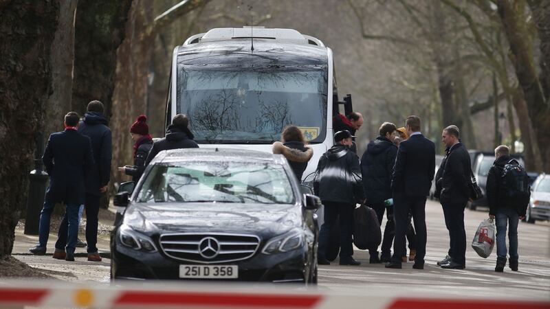 People board a van bearing diplomatic plates  after leaving the Russian embassy in London:   Britain last week announced the expulsion of 23 Russian diplomats over the spy poisoning row, prompting a tit-for-tat response from Moscow.  Photograph: Daniel Leal-Olivas/AFP/Getty