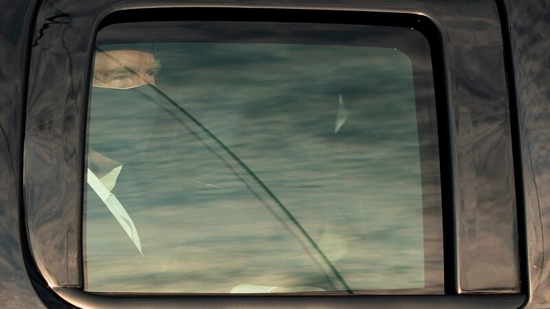 US president Donald Trump looks on from the back of a car in a motorcade outside of Walter Reed Medical Center in Bethesda, Maryland. Photograph: AFP