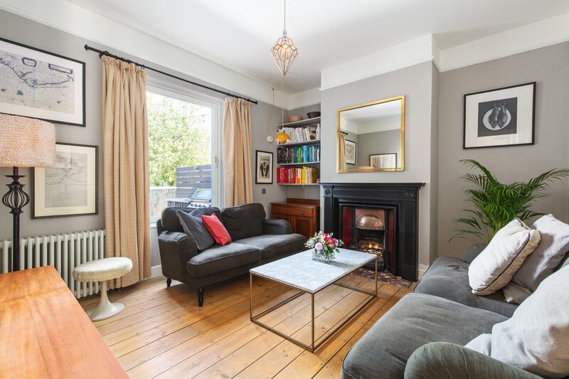 The livingroom is the next room on the hall, and gets light from a large window on to the back garden. Photograph: Keith Owens