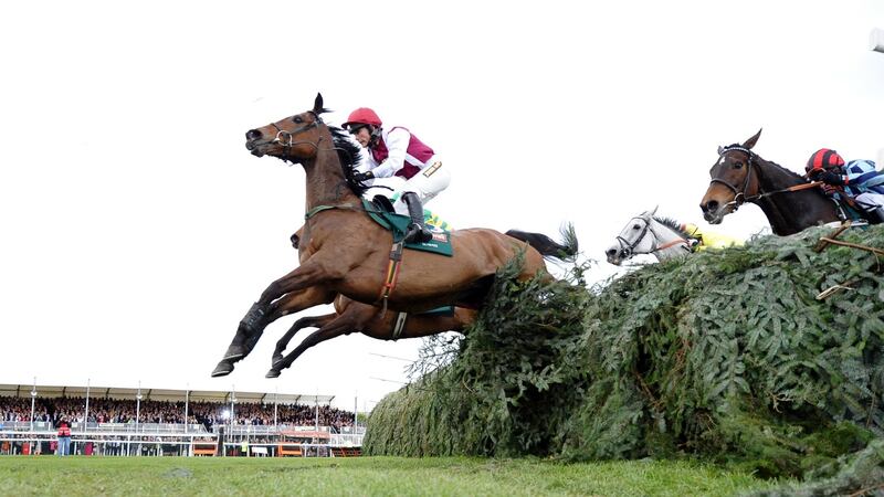 Seabass, ridden by Katie Walsh, clears the final fence in the lead  in the 2012 Grand National. Walsh and Seabass would eventually finish third, the closest a female jockey has come to winning the iconic race. Photograph: Paul Ellis/Getty Images