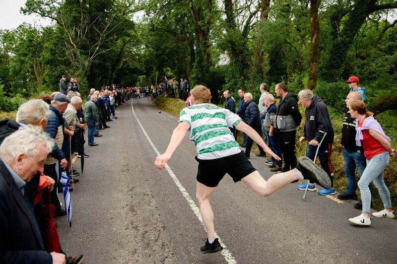 Alex O’Donovan competes during the Junior B Munster Road Bowling final at Castletownkinneigh. Photograph: Daragh Mc Sweeney/Provision