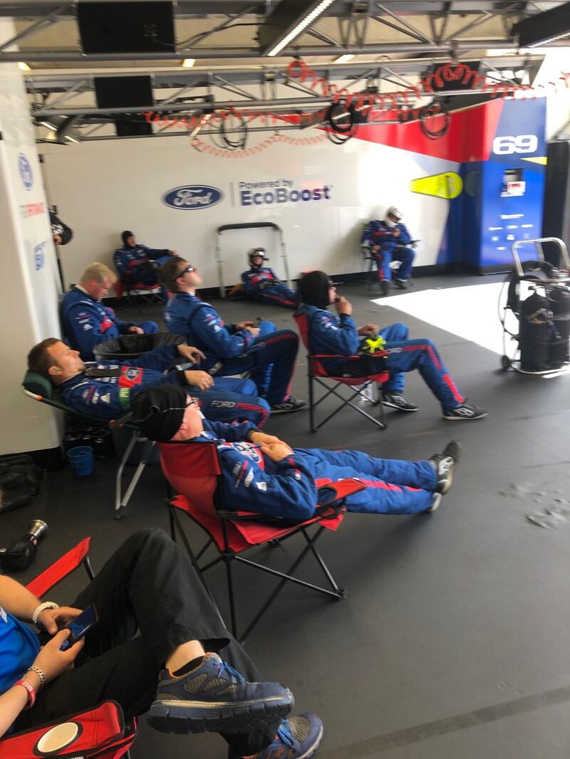 Ford’s  pit crew watch the race. When the car enters the pit, wheels are changed, the driver is swapped, the fuel is reloaded and the windscreen is cleaned – all in just 34 seconds