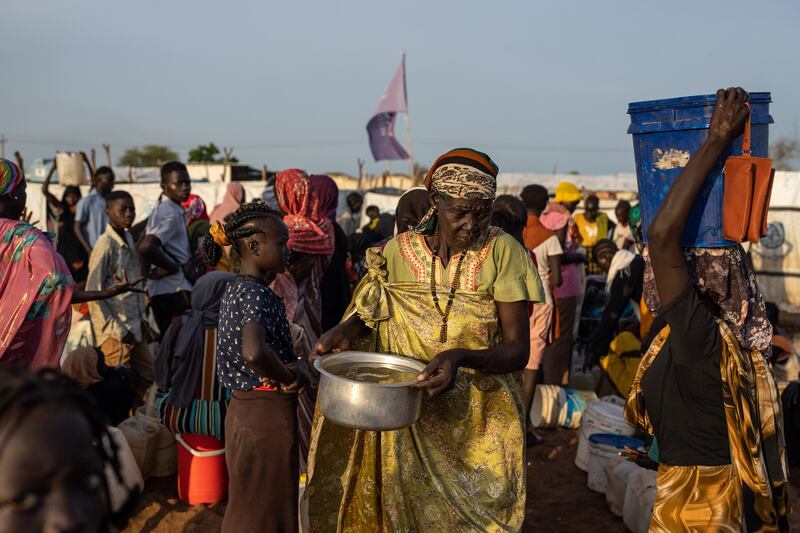 Refugees fleeing violence in Sudan at a transit camp in Renk, South Sudan. Those who had fled described an increase in robberies and killings by armed militias. Photograph: Joao Silva/New York Times
                      