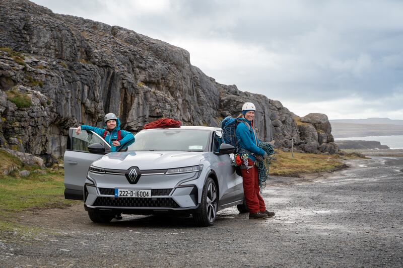 Unpacking their climbing gear from their Renault Megane E-Tech electric
