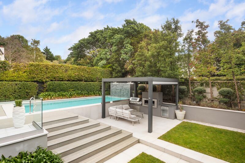 Back garden with swimming pool and barbecue. Photograph: Alex Urdaneta