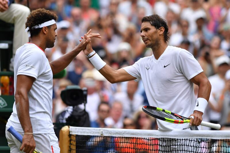 Rafael Nadal  shakes hands with France’s Jo-Wilfried Tsonga after the Spaniard’s comfortable third-round victory at Wimbledon. Photograph: Glyn Kirk/AFP/Getty Images