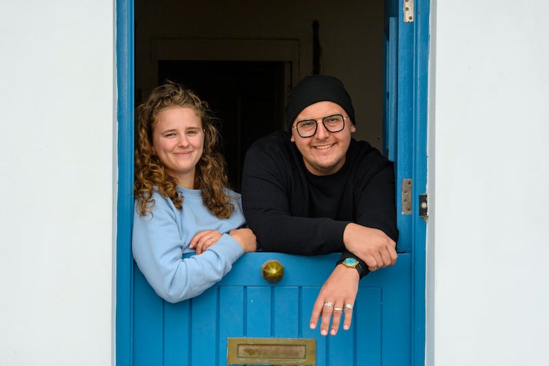 Natalia Lange and Michael Presnal take in the view from the half-door at their rented cottage in Crosshaven, Co Cork. Photograph: Daragh Mc Sweeney/Provision
