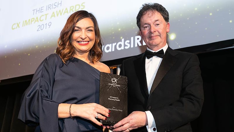 Gerard O'Neill, Awards Judge & Amárach Research presents the CX Impact in Pharmacy/Health award to Oonagh O'Hagan, Meaghers Pharmacy Group.