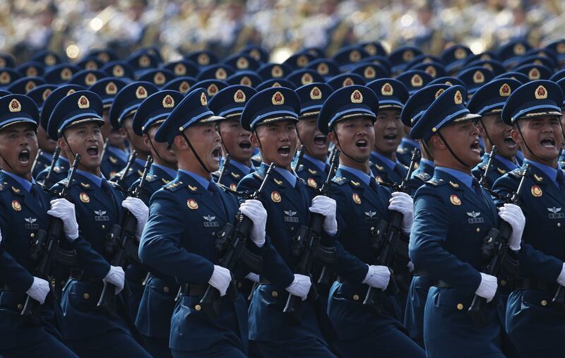 Chinese troops march in Beijing, China. Photograph: EPA