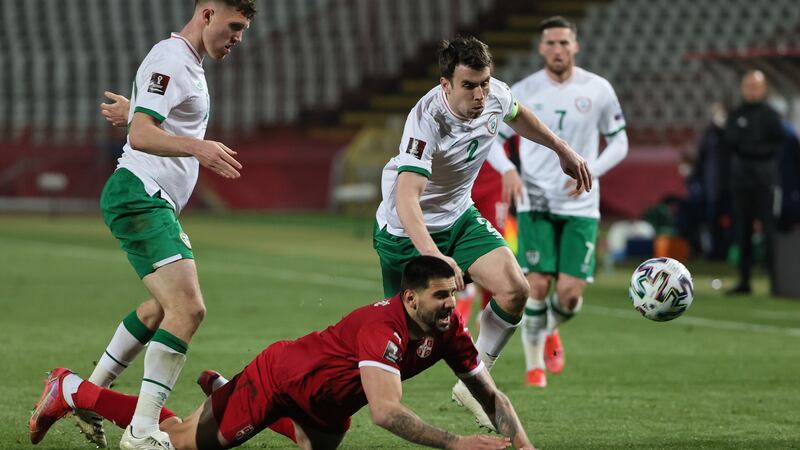 Aleksandar Mitrovic of Serbia is challenged by Ireland captain Séamus Coleman during the World Cup qualifier in Belgrade. Photograph: Srdjan Stevanovic/Getty Images