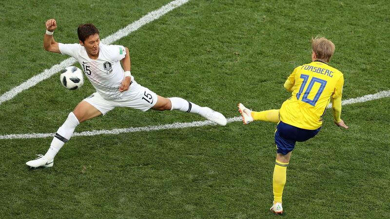 Sweden’s Emil Forsberg tries to shoot past South Korea’s Jung Woo-young. Photograph: Lucy Nicholson/Reuters