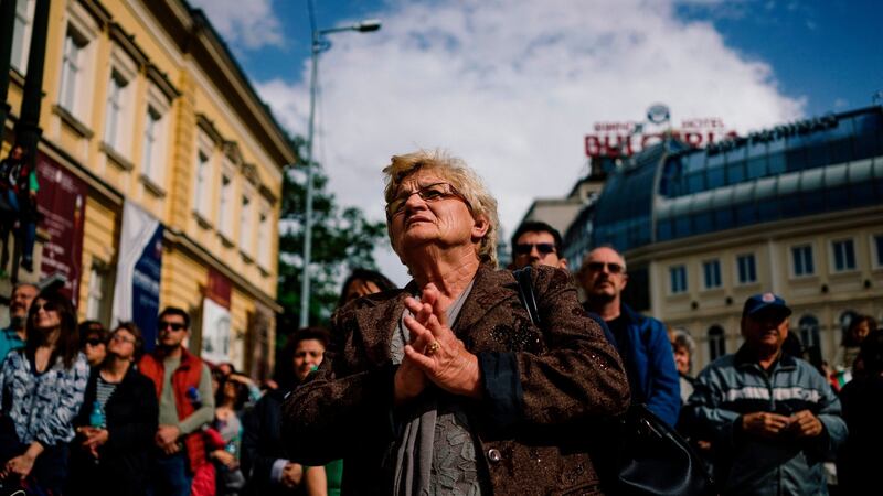 Deep in prayer during a Mass led by the pope  on Knyaz Alexander I square, Sofia. Photograph: Sofia